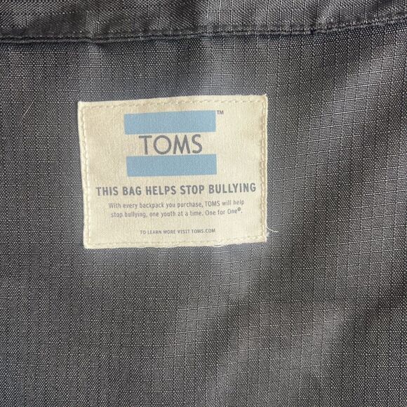 Toms StandUp Backpack Solid Black W/ Aztec detail Zipper Closure Fold-over Flaws - Picture 6 of 9